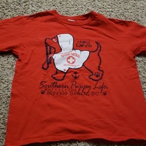 Red tee with a dog.